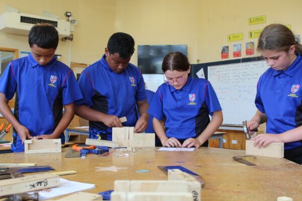 Maeroa Intermediate students building wooden projects during a technology class.