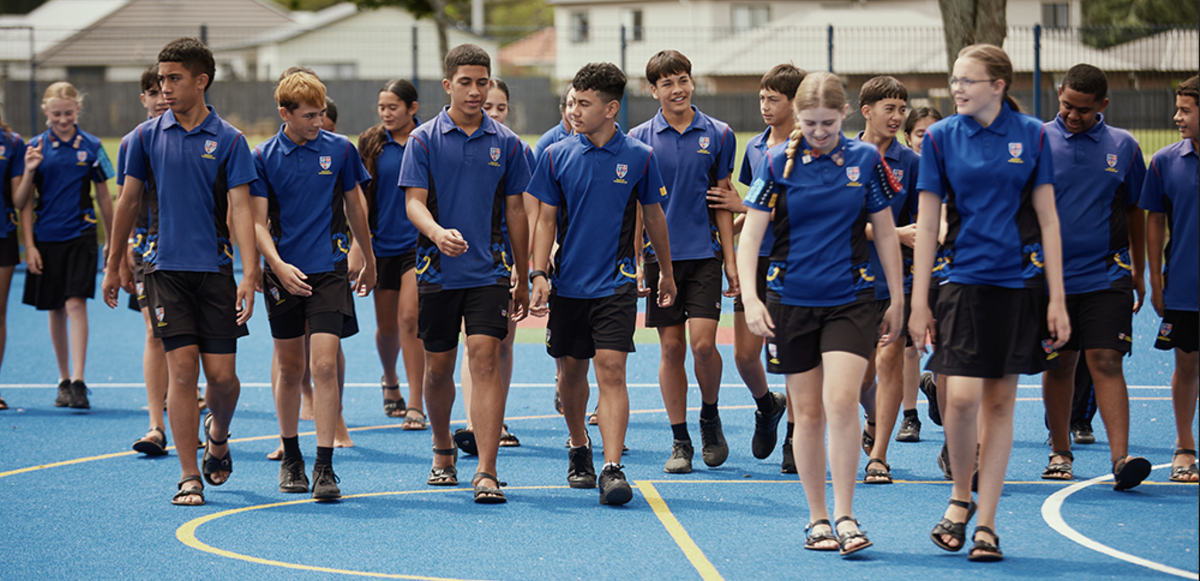 Group of Maeroa Intermediate students walking together on the school&rsquo;s outdoor court.